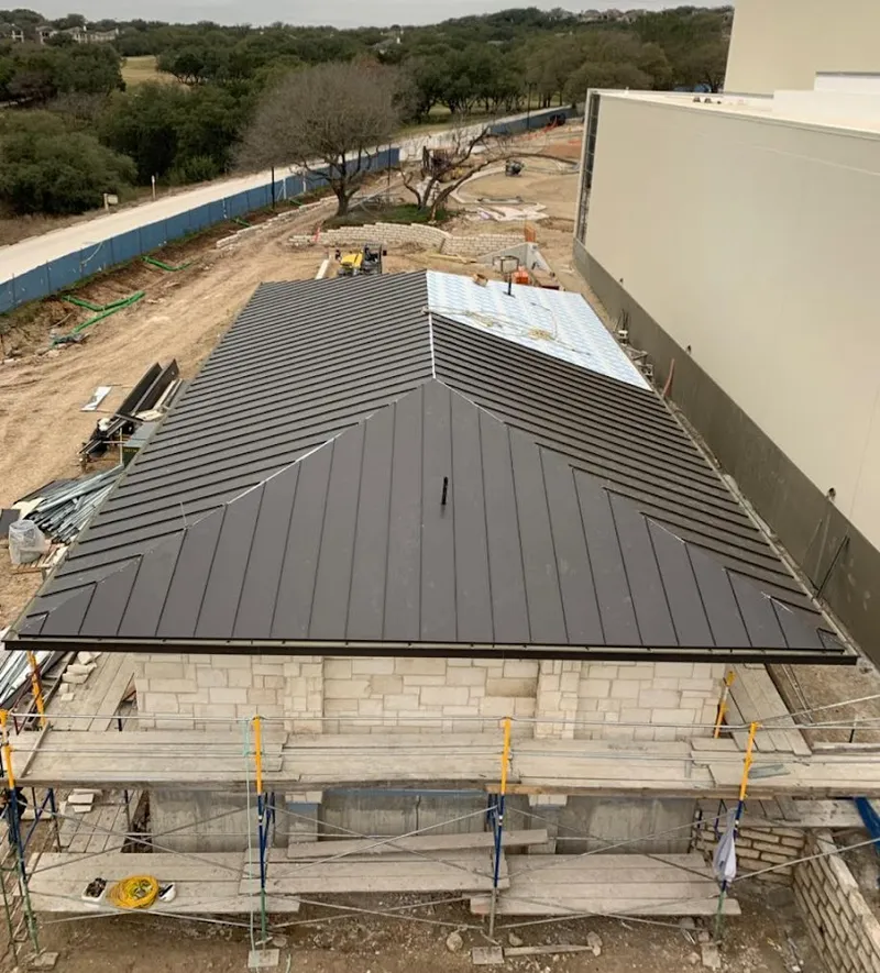 Metal roof new construction with scaffolding in Mitchell